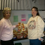 Volunteers help distribute bread