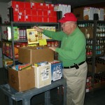 Volunteer loads family boxes